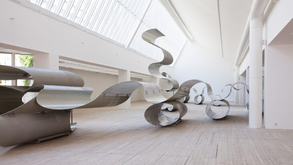 Installation picture of Siri Aurdal's giant sculpture of oil pipeline tubes in the art gallery.
