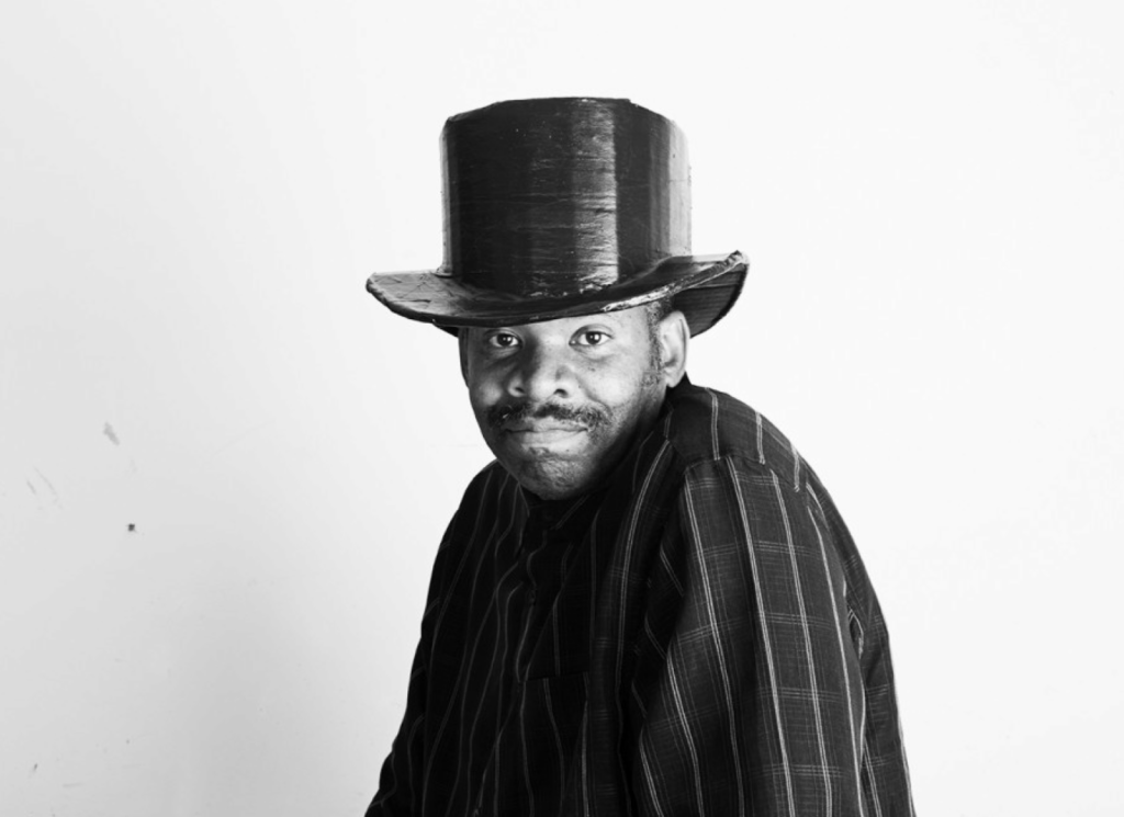 Black and white portrait of William Scott in a top hat