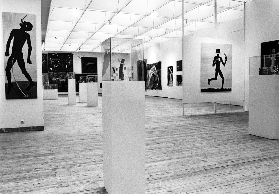 Overview image from the exhibition space. Artwork can be seen on walls and pedestals.