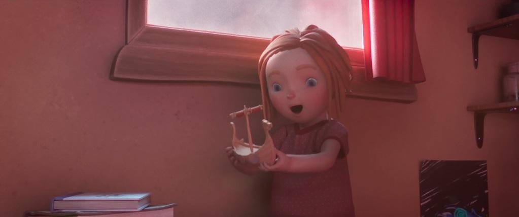 Filmstill ur animerad film föreställande en liten flicka som håller ett leksaksskepp i sina händer.