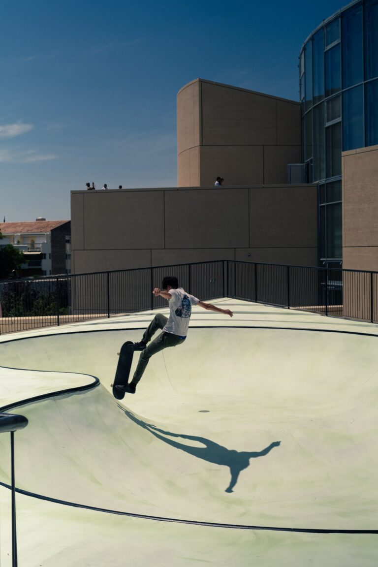 A skateboarder skateboarding on a ramp in the summer heat. The ramp is an artwork by Koo Jeong A.