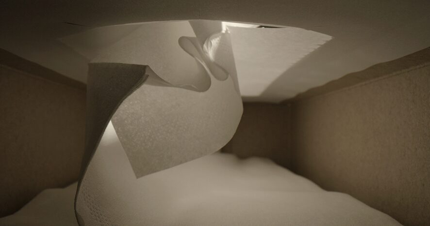 An artwork by Henriette Heisse, consisting of a film from inside a napkin box.