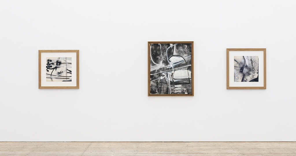 Works by Lars Fredrikson – three abstract spray paintings.